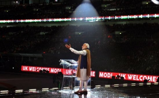 Narendra Modi UK visit 2015: Pics of electric atmosphere at Wembley Stadium for 'UKWelcomesModi' community reception The spotlight at Wembley stadium shines on Indian PM Modi as he takes the stage to address the massive crowd gathered to see him and hear him